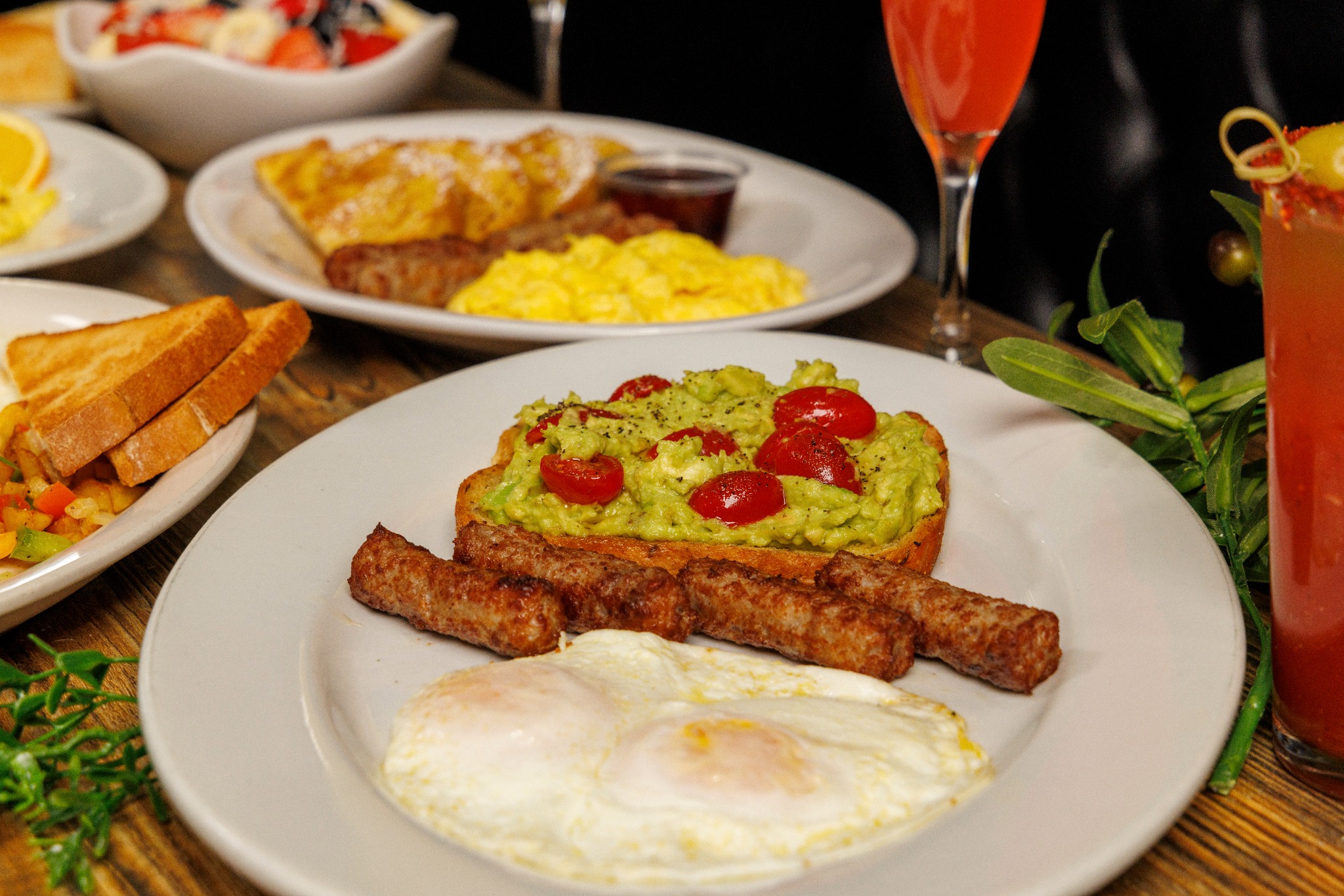 Breakfast plate with avocado toast and sausage