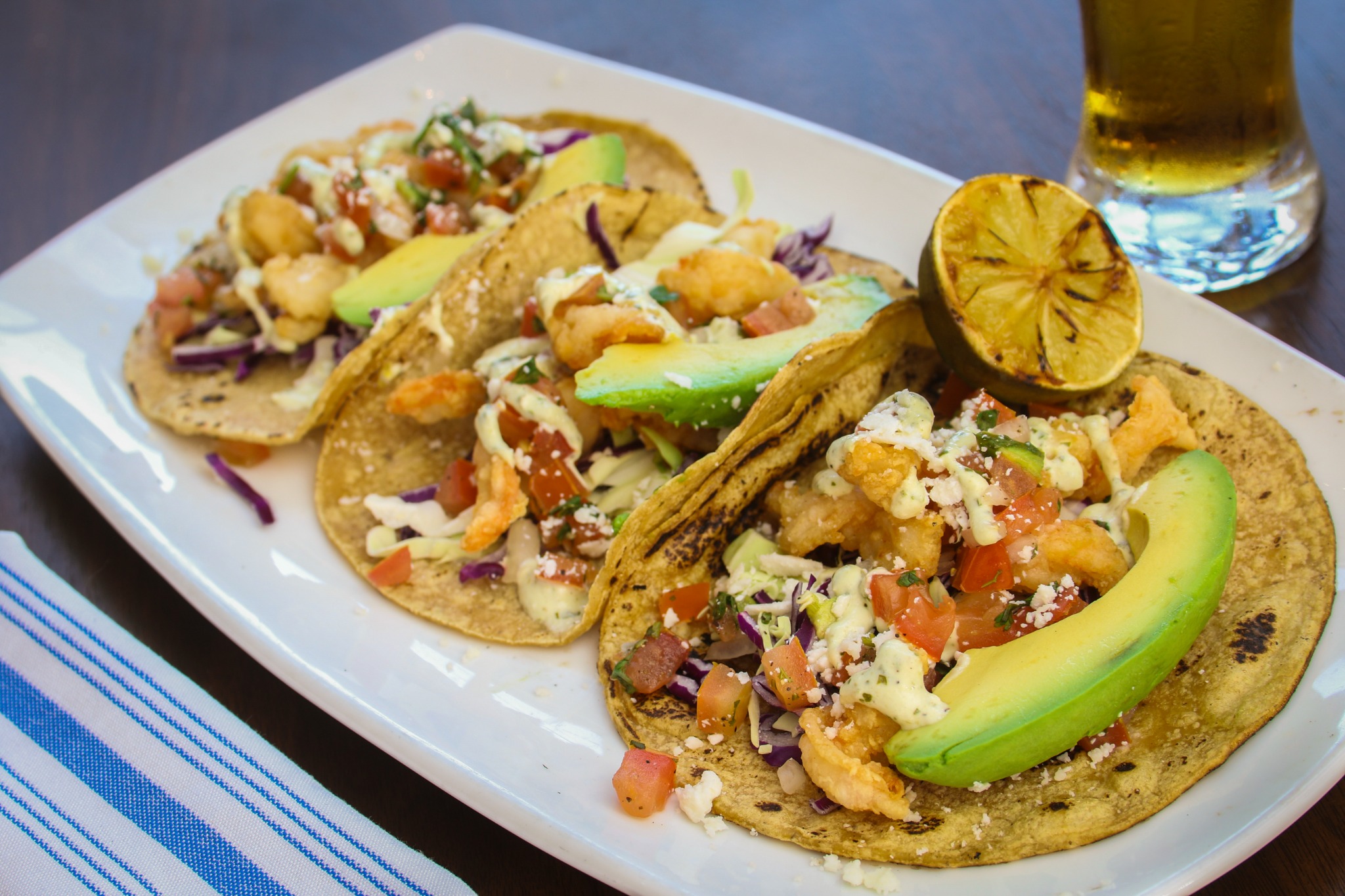 Cocktail with salted rim and orange garnish