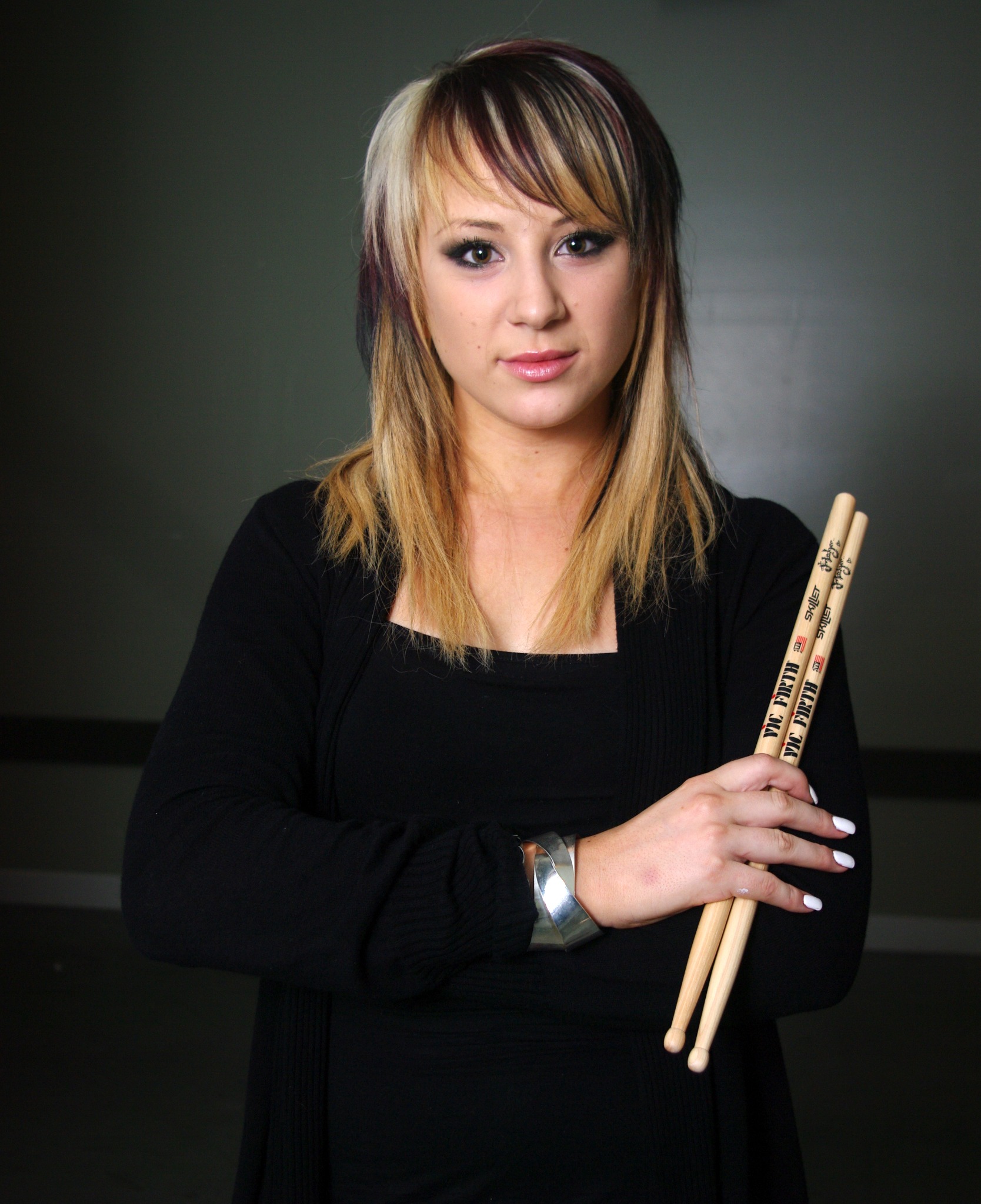 Portrait with drumsticks — studio