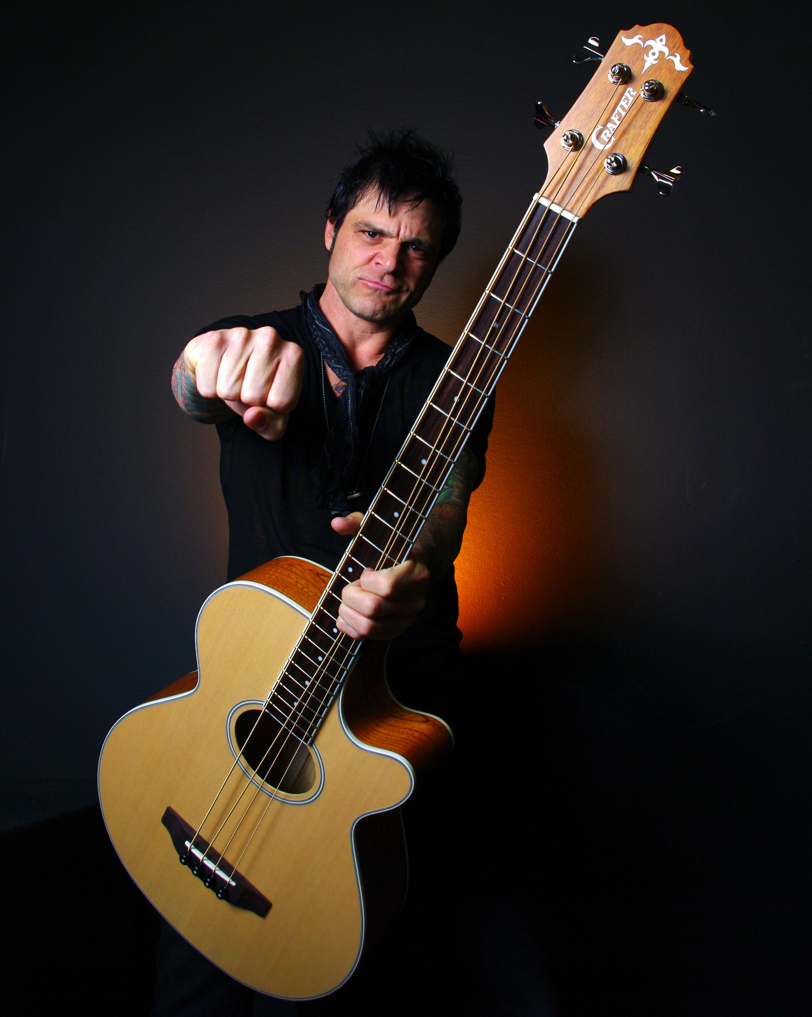 Musician with acoustic bass — dramatic lighting